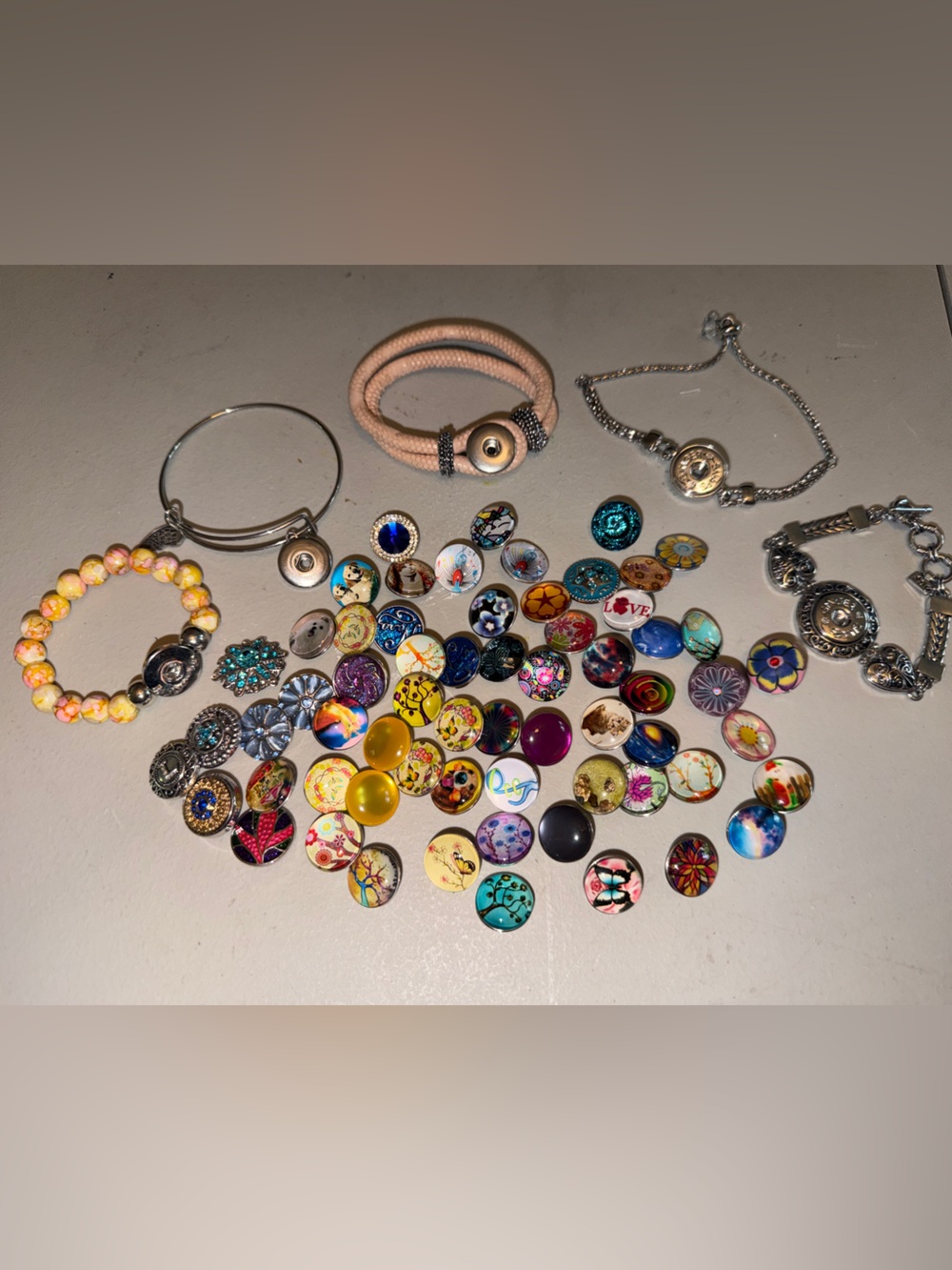 Collection of Ginger Snap bracelets and 60 interchangeable snaps